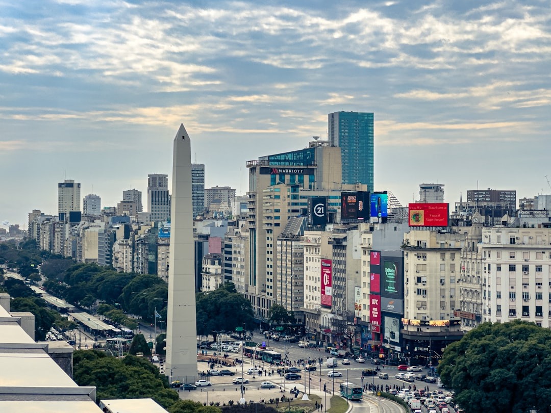 A view of a city with tall buildings and a obelisk
